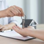 House keys being handed to new home owner or tenant