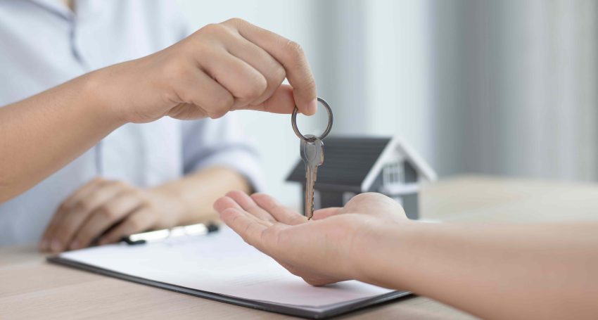 House keys being handed to new home owner or tenant