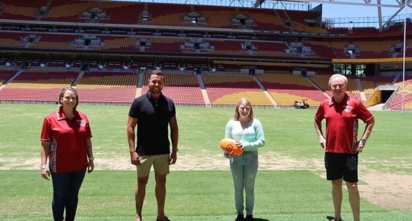 Sasha Tranter from Anglicare Southern Queensland’s Reconnect Program, with NRL Great Scott Prince