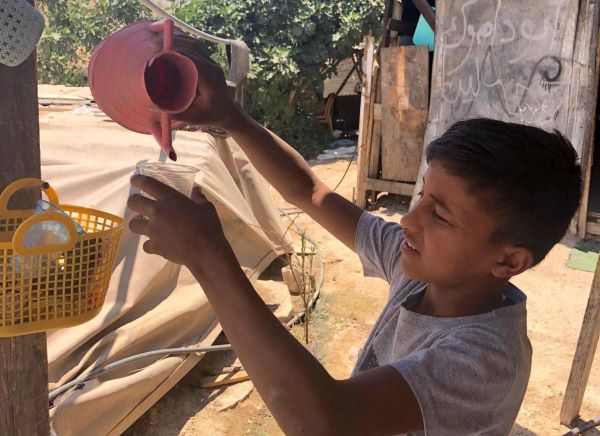 13-year-old Mohammad searches for drinking water in the Khan Al-Ahmar Bedouin community