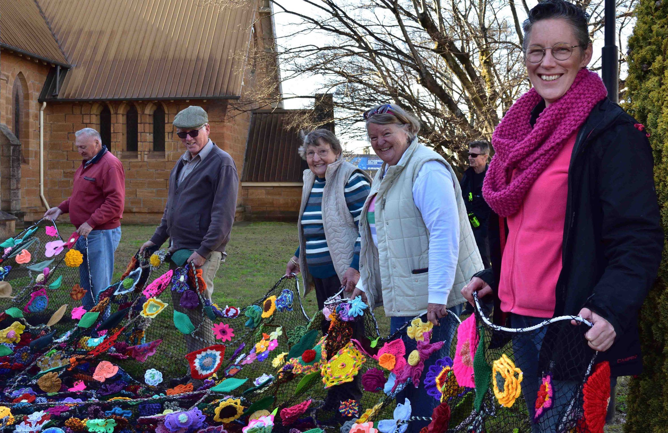 St Mark’s, Warwick community members waiting for the flower tower to be hoisted