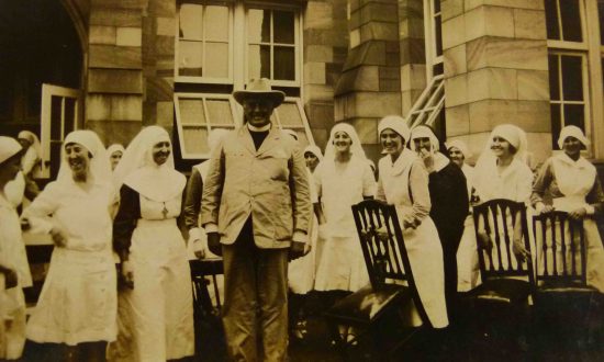 St Martin’s War Memorial Hospital nurses and a clergyperson in the 1930s