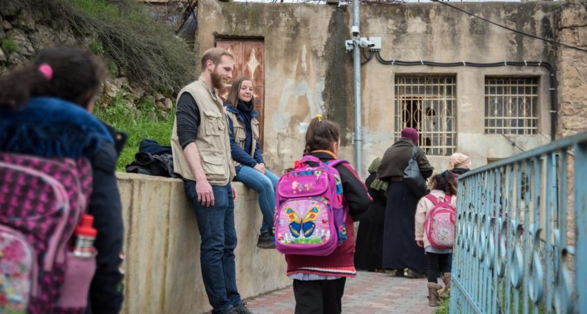 Participants in the Ecumenical Accompaniment Programme in Palestine and Israel undertake a 'school run'