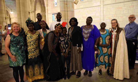 The Rev'd Mamuor Kunpeter, pictured with family and friends on the occasion of his ordination to the diaconate in December 2022