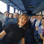 The Rev’d Canon Sarah Plowman with students on a bus to a valedictory Cathedral service in 2017