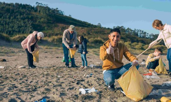 People picking up plastic waste on the beach