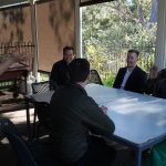 St Bart's, Toowoomba clergy and staff sitting at a table enjoying conversation