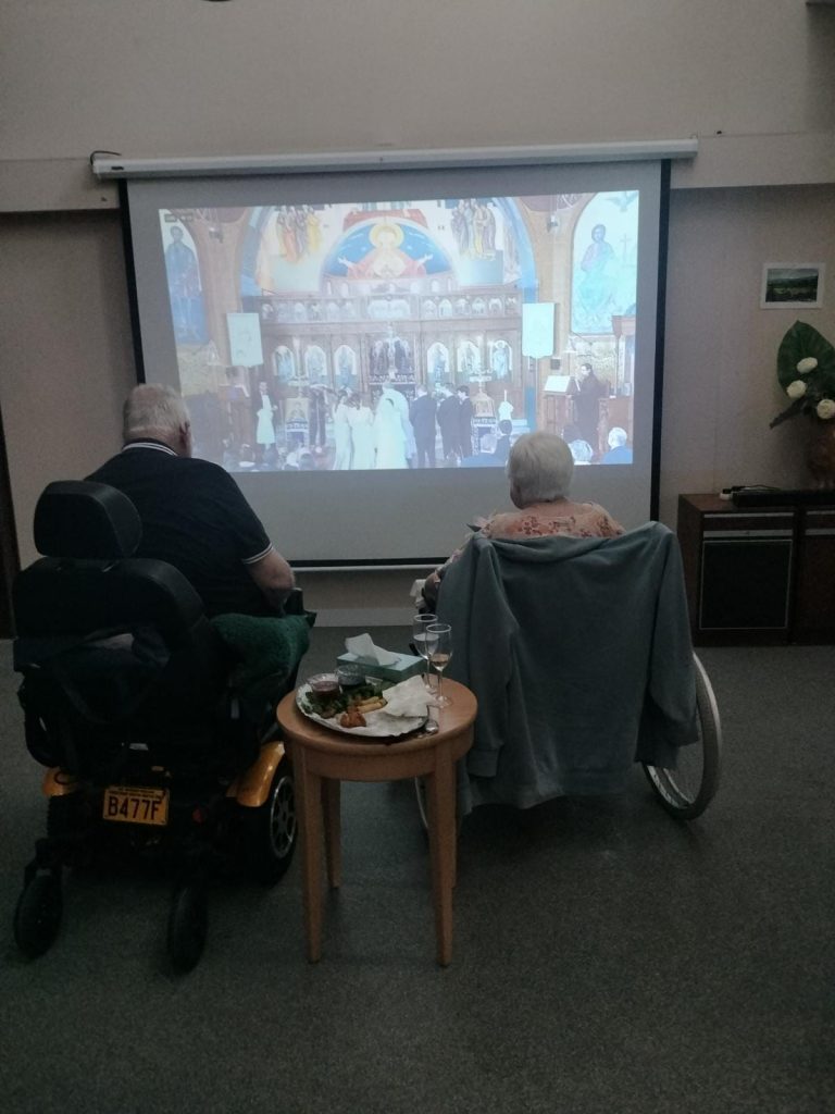 Brisbane grandparents Bob and Gloria Coit watching the wedding at EM Tooth Residential Aged Care in 2023