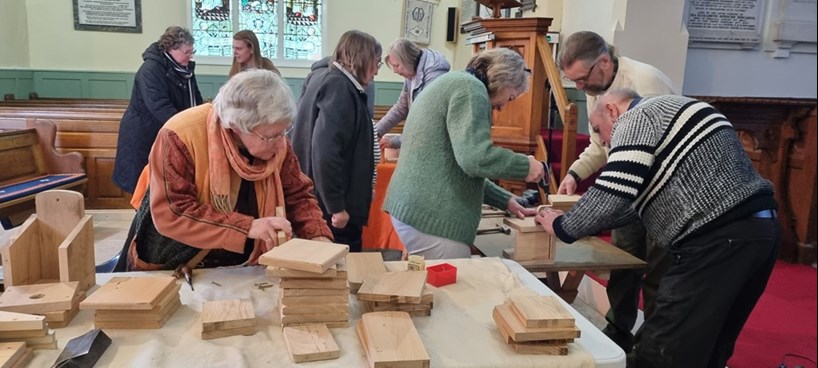 Members of the Eco Church at St Helen’s, St Helens, Isle of Wight, make bird boxes from old pews