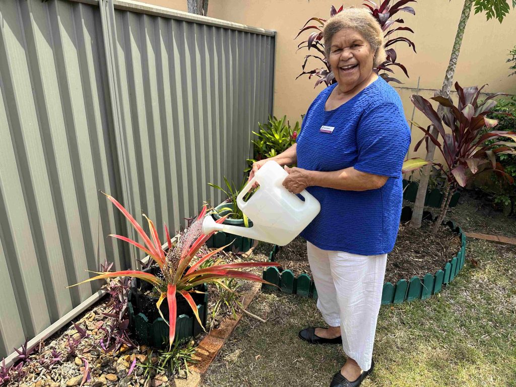 St Bart's, Mt Gravatt parishioner Anne Daddow watering her plants 