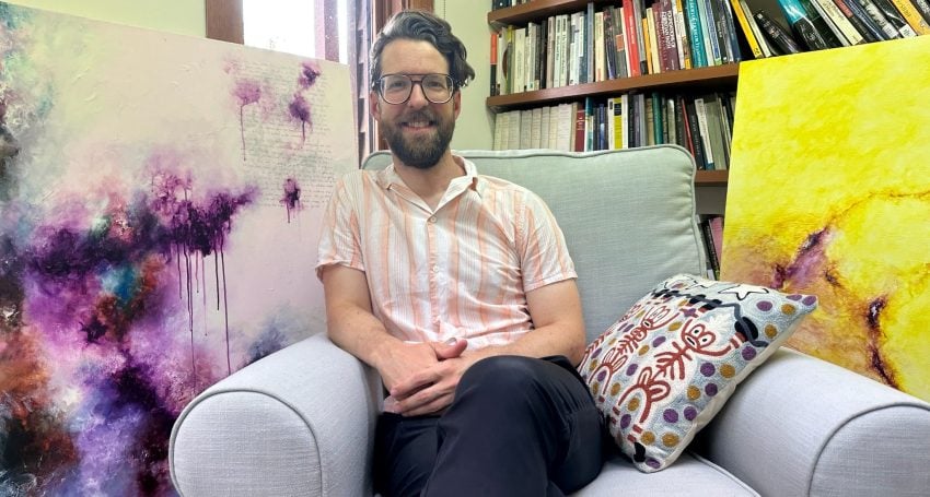 Dr Peter Kline seated in his St Francis College office