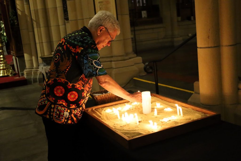 The Rev’d Dr Greg Jenks, formerly dean of St George’s College in Jerusalem, lighting a candle