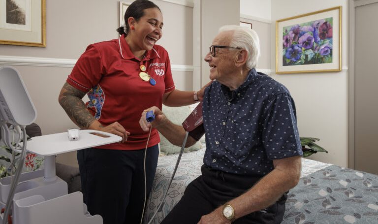 Symes Grove Residential Aged Care nurse and client in 2022