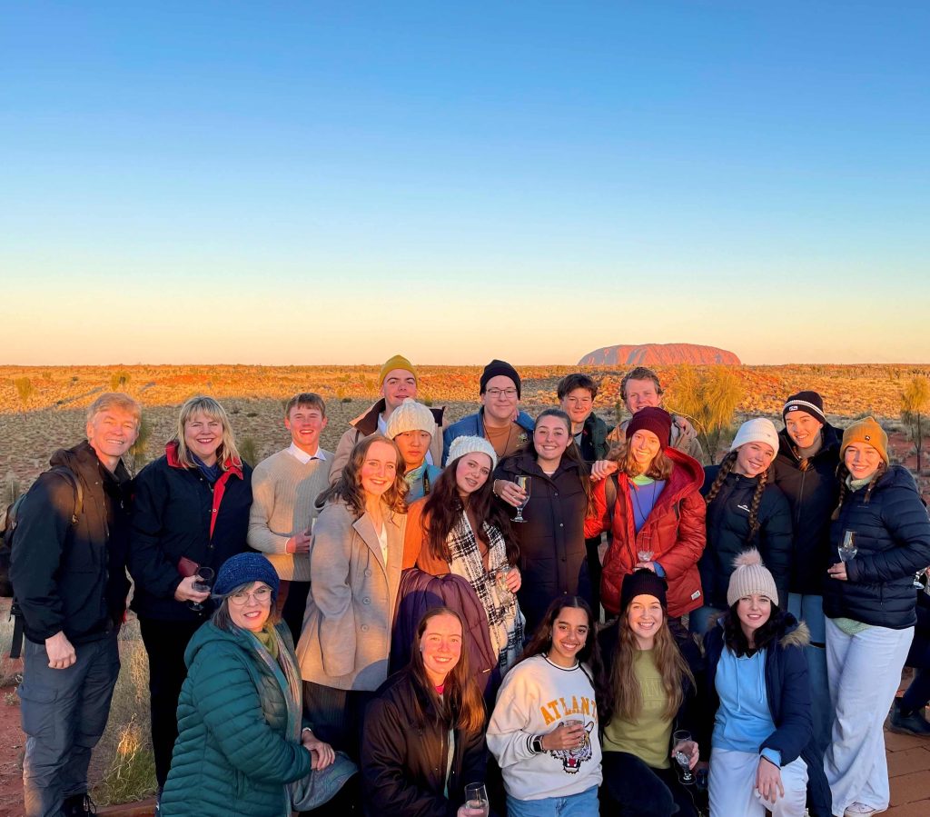 Dom Fay with the 2023 Coomera Anglican College Desert Retreat crew at Uluru. 