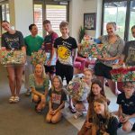Resident families from The Southport School gathered on Thursday 14th of December at TSS to pack hampers for Anglicare Children's Youth and Families Clients along with Felicity Dougherty, Spiritual and Pastoral Care Coordinator for the Gold Coast from Anglicare Southern Queensland