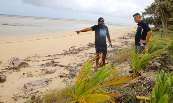 "Torres Strait Eight" Traditional Owner Yessie Mosby showing Archbishop Jeremy Greaves the impacts of climate change