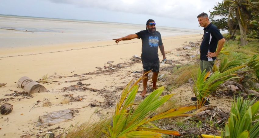 "Torres Strait Eight" Traditional Owner Yessie Mosby showing Archbishop Jeremy Greaves the impacts of climate change