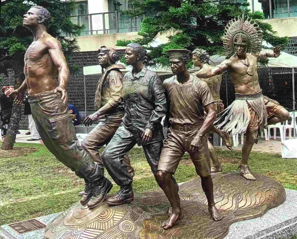 A bronze memorial to Aboriginal and Torres Strait Islander service men and women: six bronze figures of army, navy and airforce personnel 