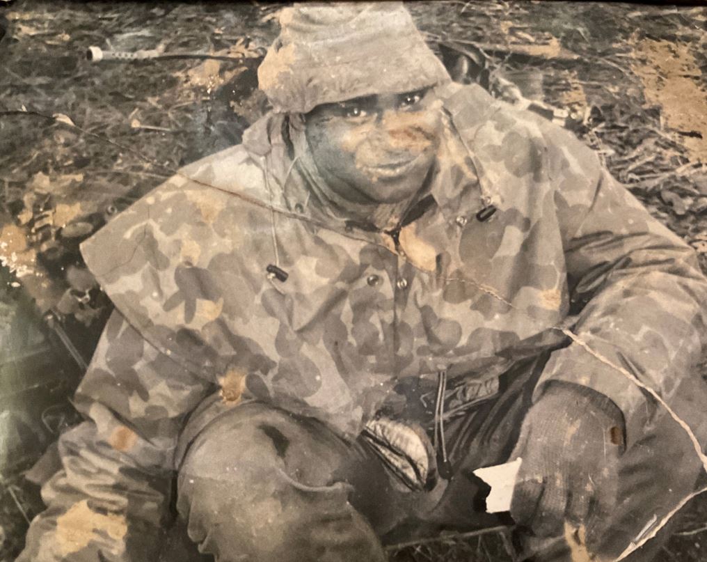 Torres Strait Islander man wearing army camouflage uniform 