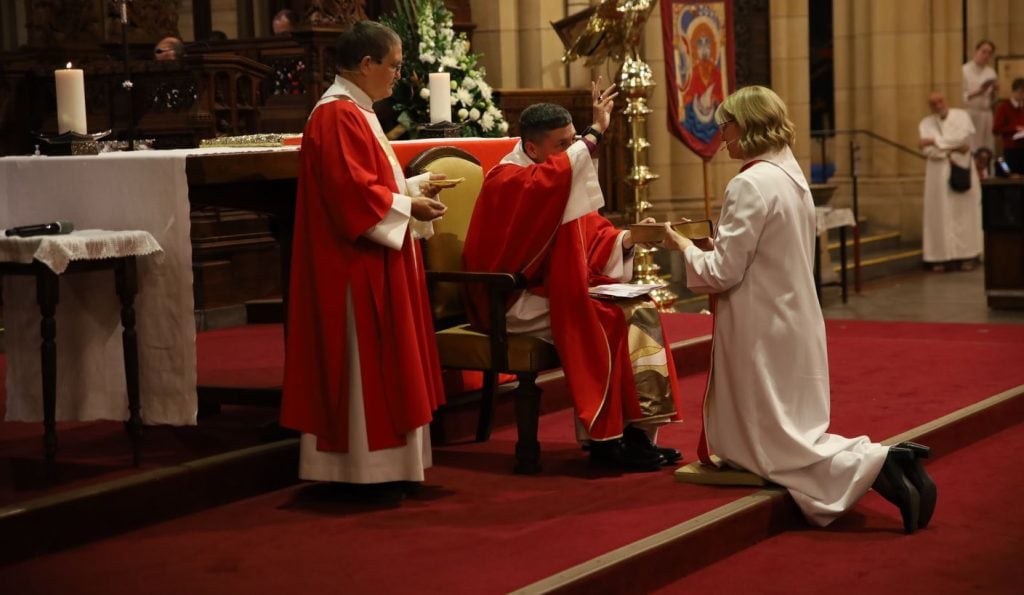 Woman being consecrated bishop