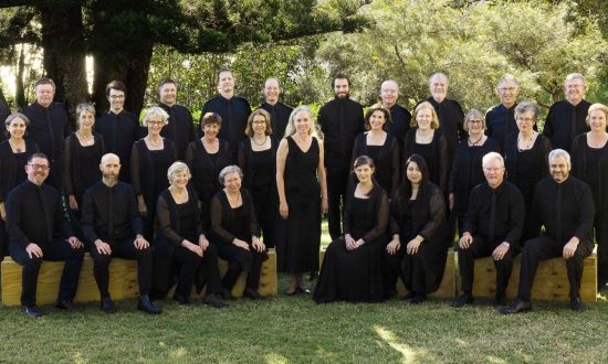 Large choir wearing black outside