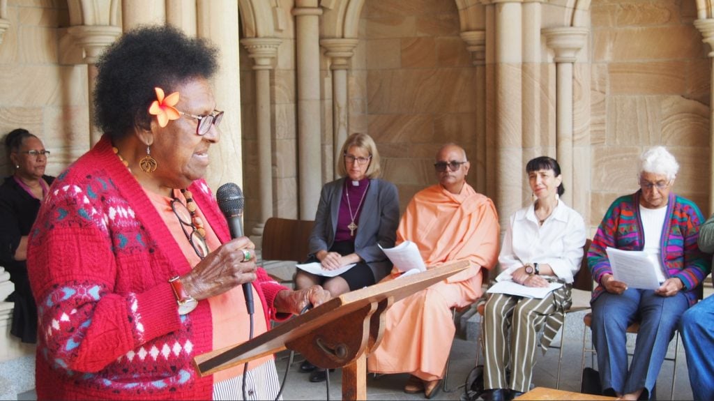 Torres Strait Islander elder speaking outside a Cathedral to inter-faith leaders 