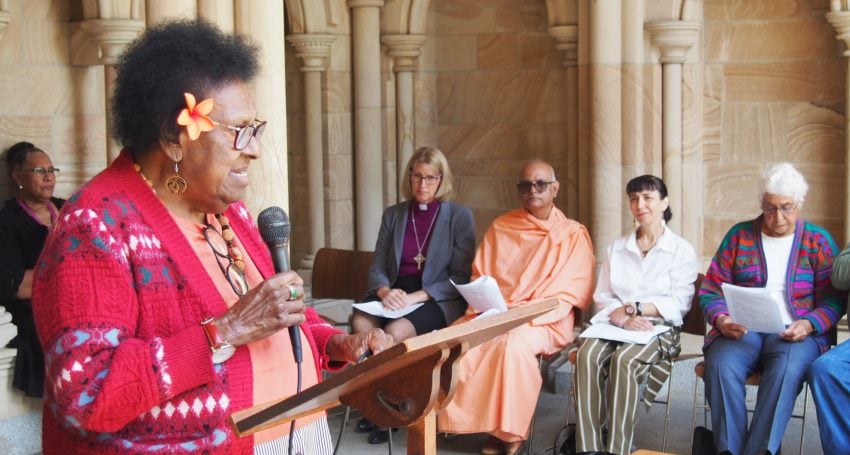 Torres Strait Islander elder speaking outside a Cathedral to inter-faith leaders