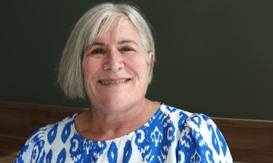 Woman wearing blue and white shirt