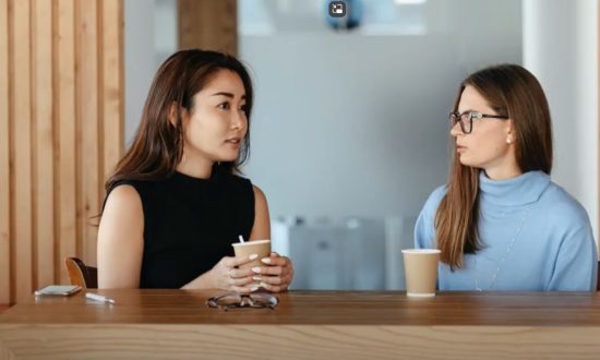 Two young women having coffee