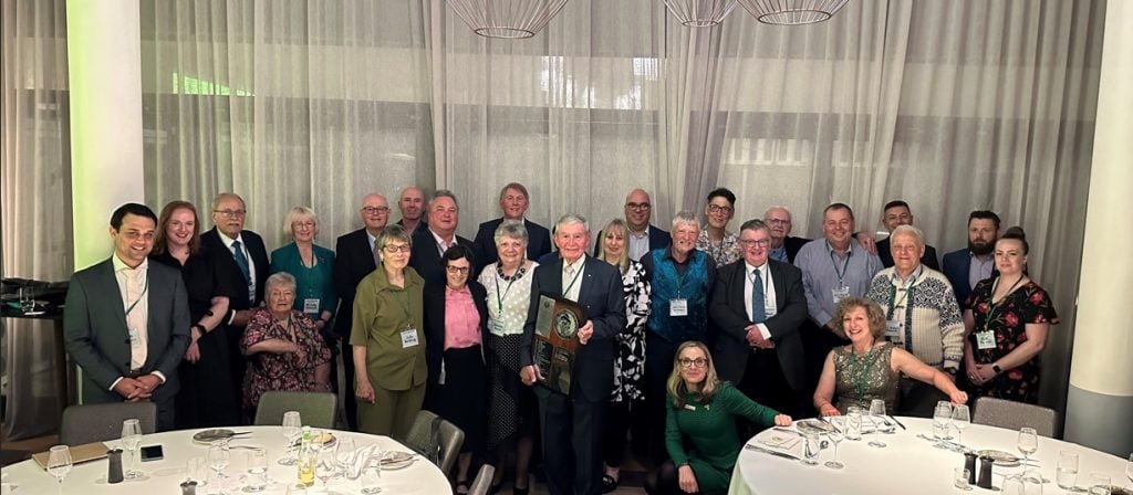 People at a dinner gathered in a group shot