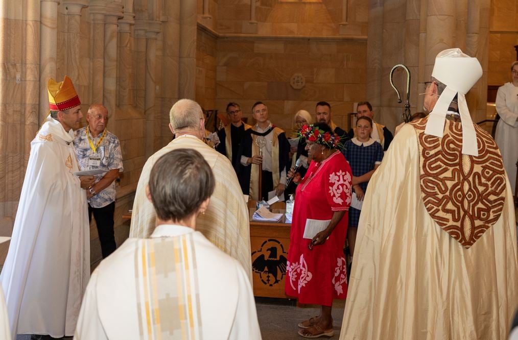 Torres Strait Islander elder welcoming a bishop in a cathedral 