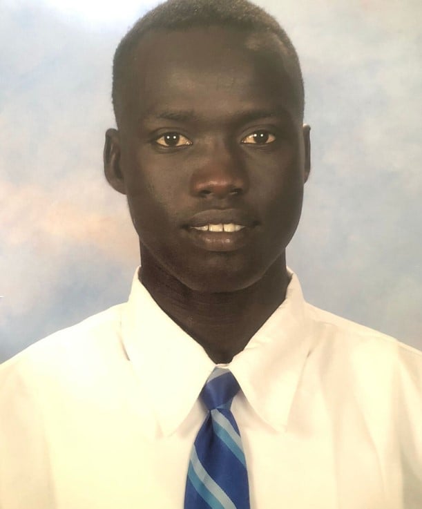 High school student in white shirt and blue tie