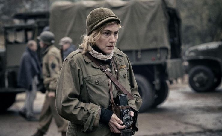 Woman war photographer holding a camera