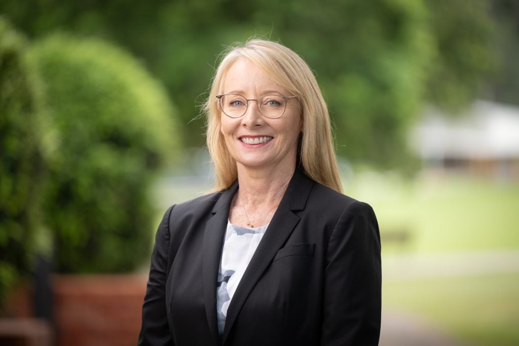 Smiling woman in suit 