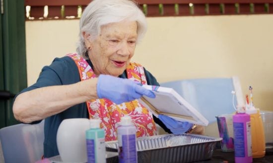 Elderly woman doing art