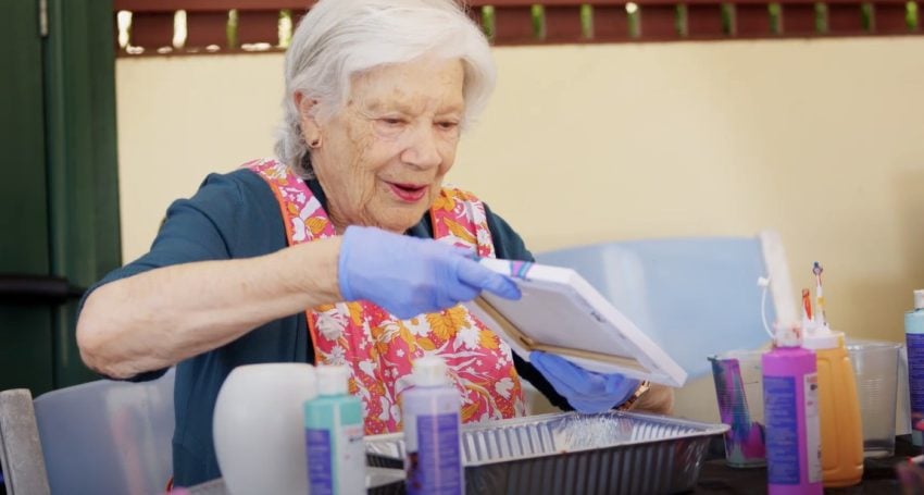 Elderly woman doing art