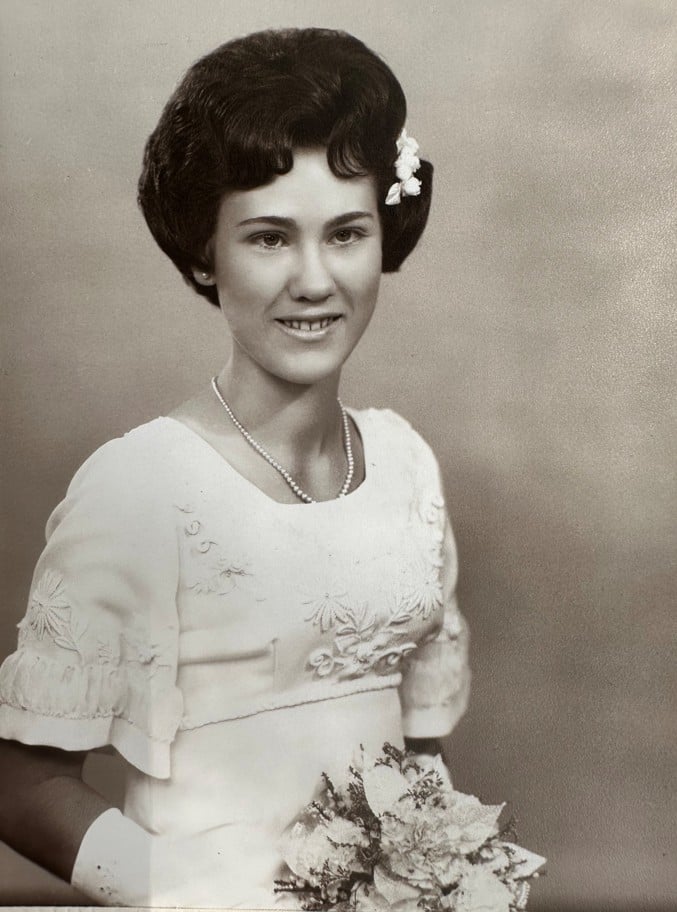 Young woman in white dress making her debut