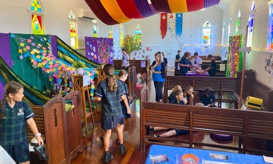 School children in a chapel exploring prayer spaces