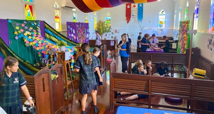 School children in a chapel exploring prayer spaces