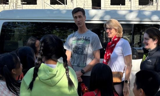 Bishop Sarah Plowman, husband Darius Cartwright, and Rev’d Juliana Bate chat with students at All Saints Mission Incorporated School