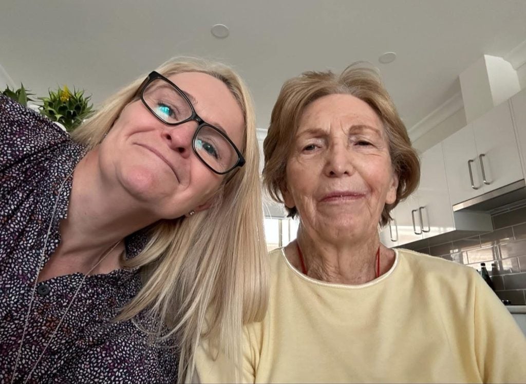Two women smiling for a photograph
