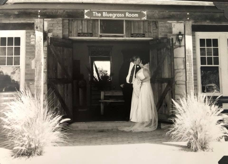 A couple kiss on their wedding day