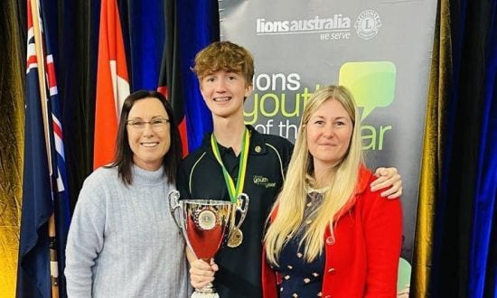 FCAC student Jasper poses with his trophy at the Lions Youth of the Year competition alongside Head of Secondary School Juliane Hallam and Head of English Maxime Saltmarsh