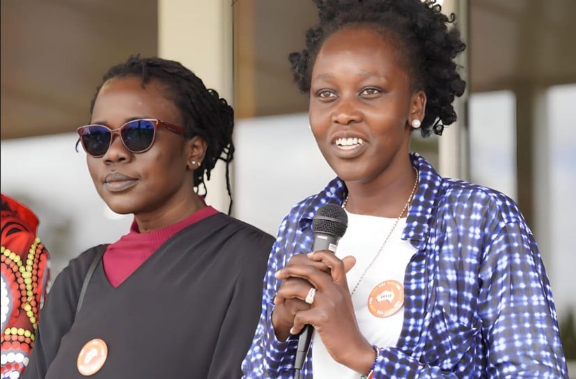 Two women at a Yes23 referendum event, with one holding a microphone