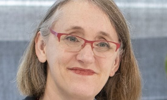 Woman in glasses smiling