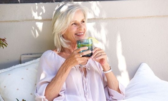 Older woman drinking water