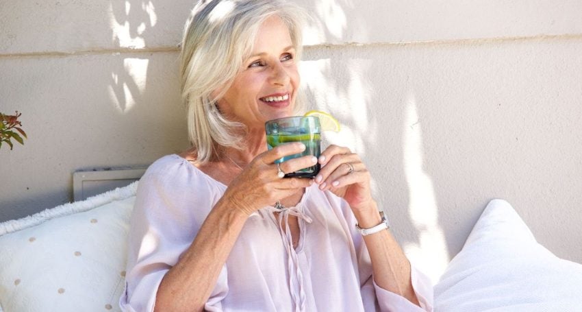 Older woman drinking water