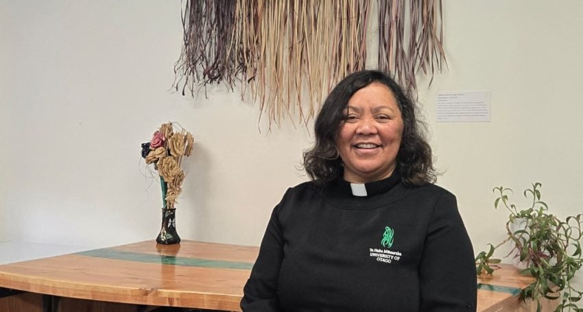 Māori priest in her office