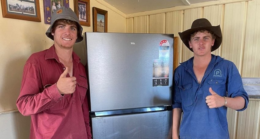 Two teenage boys stand in front of a fridge for a photo to promote the campaign