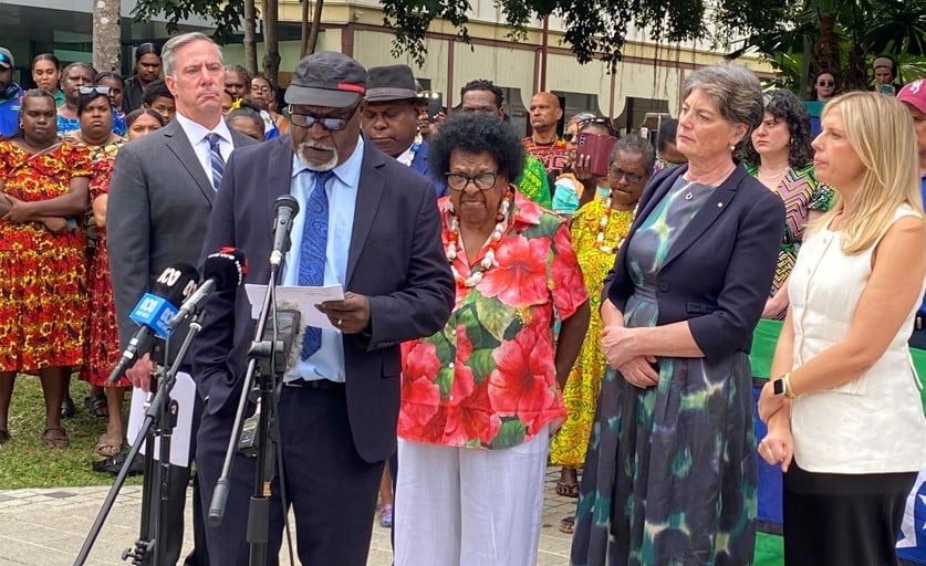 Torres Strait Islander Elder outside a courthouse with supporters